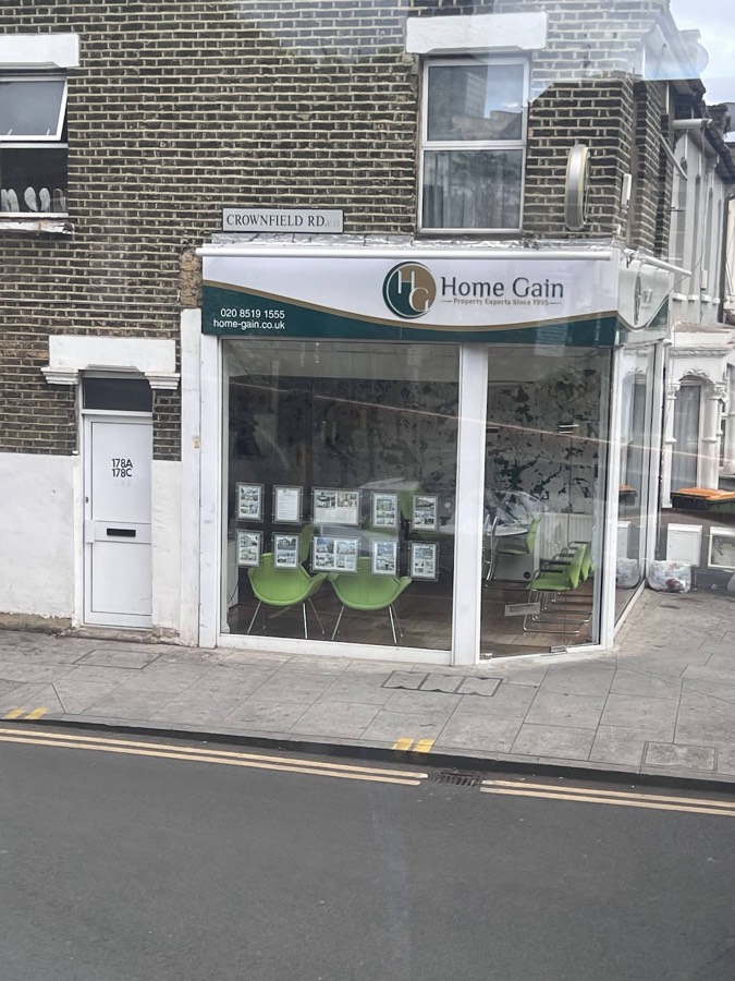 The HomeGain office on the corner of Major Road and Crownfield Road, Stratford E15, with property listings in the window